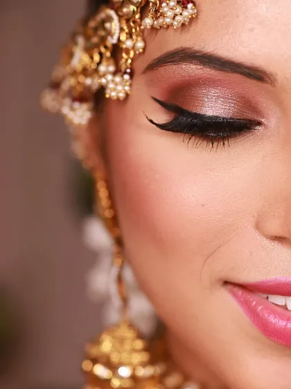 The art is in the details. A close-up of the shimmering eyeshadow and flawless eyeliner that brings this bridal look to life.