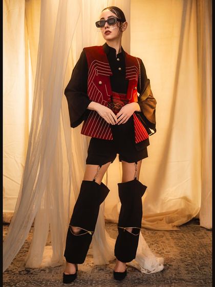 An avant-garde fashion look that required a careful balance of composition and lighting. We used warm ambient light and a low camera angle to create a powerful visual narrative that highlights the outfit's unique structure.