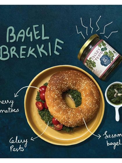 A simple and delicious Bagel Brekkie. A toasted sesame bagel generously spread with my Celery Pesto and topped with fresh cherry tomatoes for a no-mess weekend breakfast.