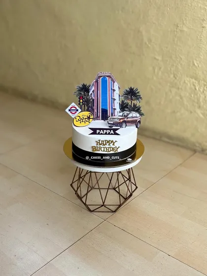 A custom cake designed to look like the Hotel Atharva building, a very personal and unique birthday gift for "Pappa".