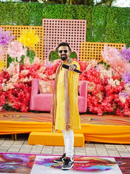 A full view of the beautiful and colorful Haldi stage setup. A great ambiance always enhances the celebration.