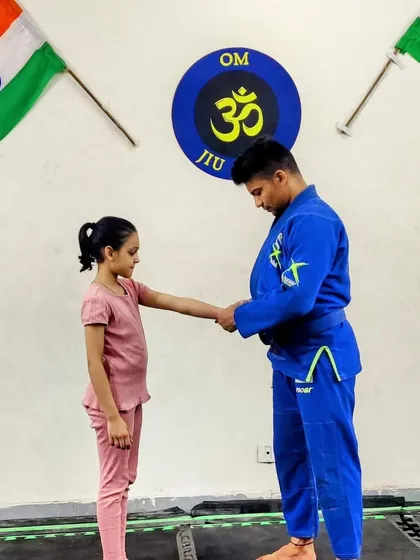 A proud moment for this young student, receiving her well-earned stripe. We are honored to guide these kids on their martial arts journey.