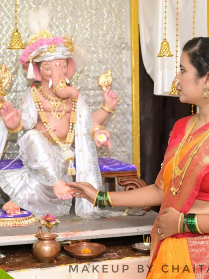 A traditional look for a festive occasion. The makeup is natural and minimal, paired with a classic hairstyle adorned with a gajra, perfect for a Ganpati festival celebration.