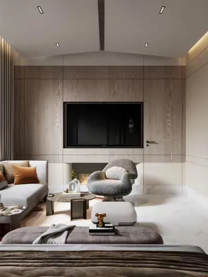 A spacious and bright master bedroom suite with a dedicated seating area by the window. Our renders capture the airy feeling of the room, the elegant furniture, and the seamless integration of a modern fireplace.