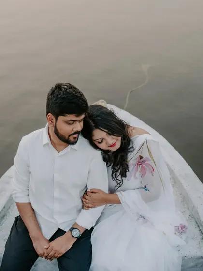 After the proposal, a quiet moment of reflection on the boat. These are the peaceful, in-between moments we love to capture, where the reality of the commitment sinks in.