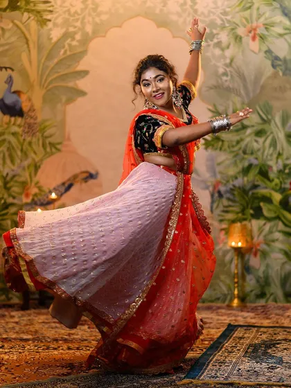 We create moments of pure cinematic joy. This dynamic shot captures the vibrant spirit of Leela from 'Ram-Leela', with the colorful lehenga in full twirl, showing the life and energy we bring to every character styling.