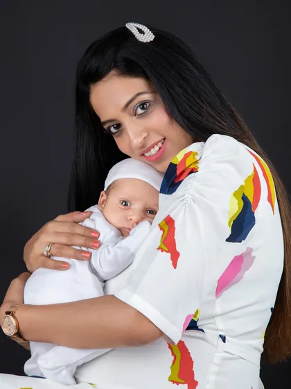 A mother's gentle embrace. This photo captures the beautiful, quiet bond between a mom and her newborn baby.