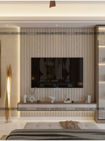 The media wall in this bedroom is designed with fluted paneling and a floating console. A tall, fluted glass display cabinet provides elegant storage, while a large piece of abstract art adds a personal touch.
