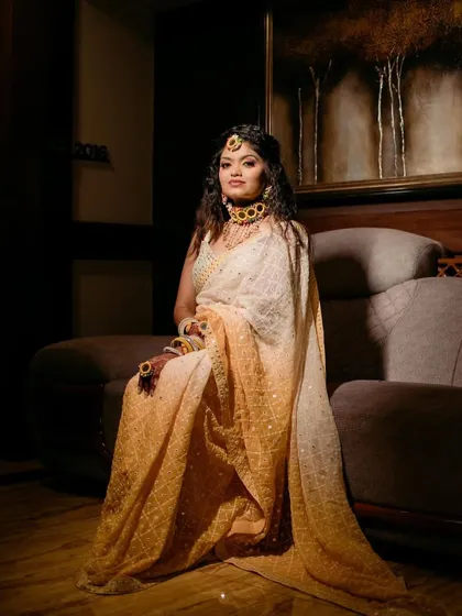 Another view of the royal glam Haldi look. The bride looks like a queen, with her glowing makeup and regal posture.