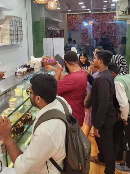 Another shot of the happy crowd during our offer day. I love interacting with my customers and helping them choose the perfect cake for their celebration. Your satisfaction is what drives me.