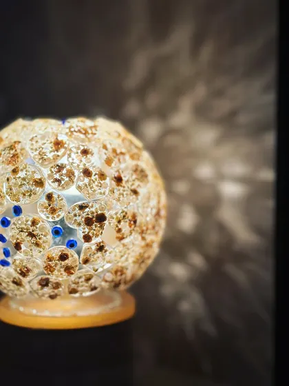 Imagine your wedding flowers lighting up your room. This is one of my most loved creations, a custom globe lamp made from a couple's varmala. It's not just a lamp; it's a glowing reminder of your big day, handcrafted with love and a little bit of magic.