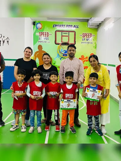 The whole group celebrates with Daksh. It takes a team to raise a champion.