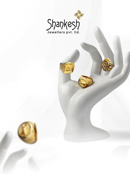 Crafted to shine, designed to dazzle. This image displays a variety of our men's gold rings on a mannequin hand, demonstrating their bold presence and appeal.