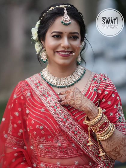 Pretty bride Amruta, looking radiant in her red lehenga. My artist Swati created a fresh and glowing look with a simple bun adorned with white flowers.