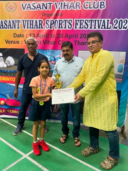 Girls U-11 winner Shanaya Tavate with her trophy and certificate.