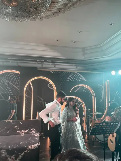 The couple takes the stage at their beautiful, modern-themed wedding reception. Our service is designed to blend seamlessly with your event's aesthetic.