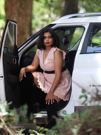 This shot has a candid, in-the-moment feel, as if the subject is just stepping out of the car.