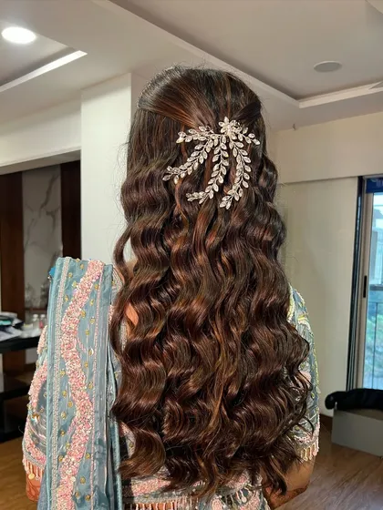 Another view of the voluminous curls, perfect for a glamorous evening event.
