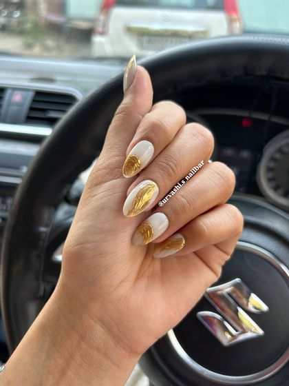 A striking design featuring a matte white base with textured gold chrome accents. The contrast between the simple white and the metallic gold creates a modern and luxurious look.