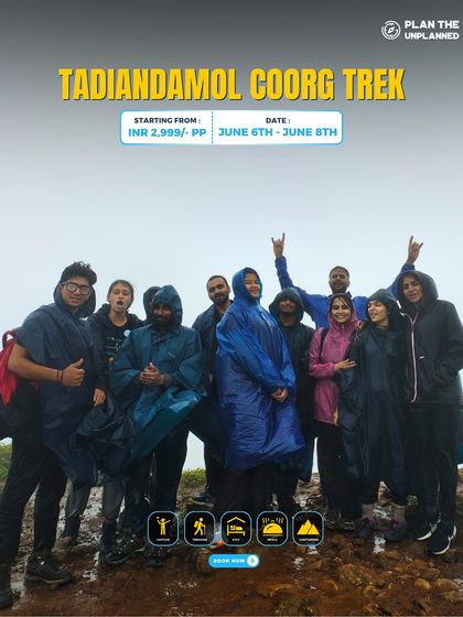 A group, including a friendly dog, poses on the Tadiandamol Coorg trek.