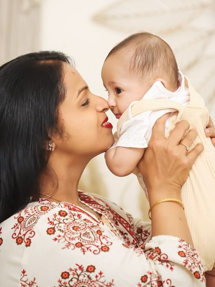 The sweet, playful interaction between a mother and her baby. These unposed moments of connection are what make a family photoshoot so special and authentic.