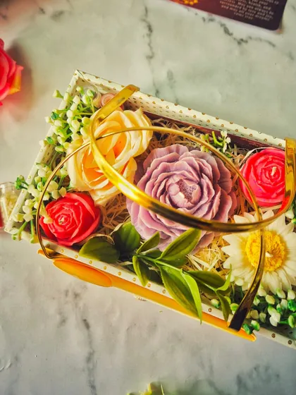 My Flower Bouquet Gift Hamper is like a garden in a box. It’s filled with four of my hand-poured floral candles, nestled amongst beautiful decorations, making it a truly stunning and fragrant gift for someone special.