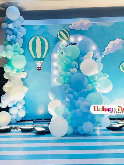 Another view of the hot air balloon stage, showing the custom backdrop with clouds and balloon graphics.