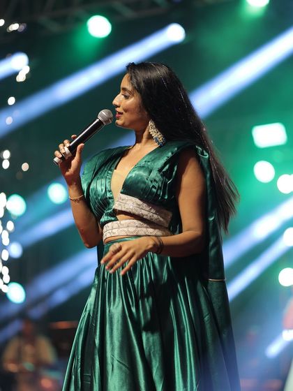 A side view of the performance outfit, showing the beautiful fall of the cape. It adds drama and elegance to the overall look.