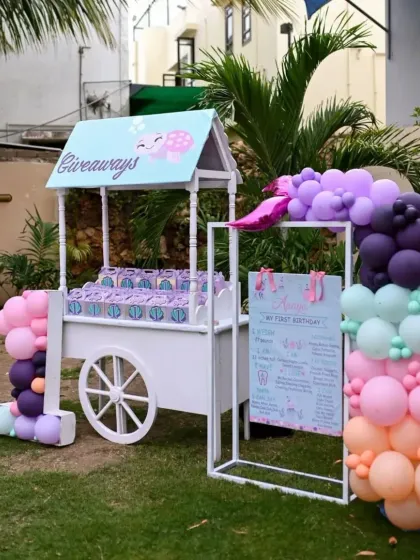 A custom giveaway cart filled with themed party favors, ensuring every little guest takes a piece of the ocean magic home with them.