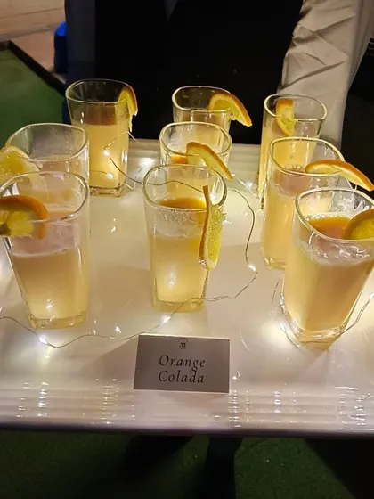 Our refreshing Orange Colada mocktails served on an illuminated tray. We pay attention to presentation to ensure our beverages look as good as they taste.