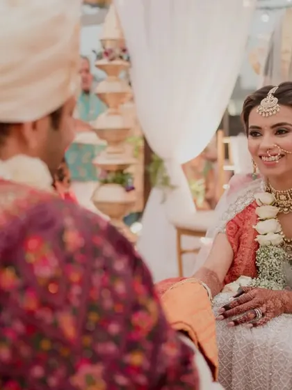A quiet moment of connection between the bride and groom during their wedding ceremony. We ensure the setup allows for these intimate exchanges.