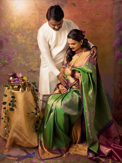 A tender moment between a couple during their traditional maternity shoot. The husband gently holds his wife's baby bump, a classic pose full of love and connection.