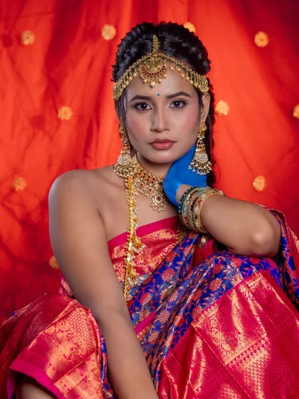 This portrait showcases the front view of the hairstyle, with the maang tikka perfectly integrated into the look.