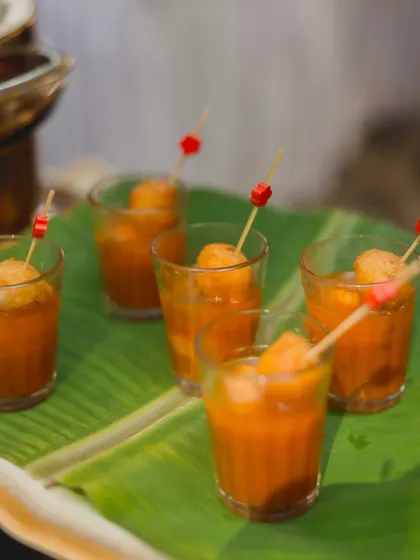 I love serving classics in new ways, like these Rasam Vada shots. A crispy vada is served on a skewer over a shot glass filled with hot, tangy rasam, making it a convenient and stylish appetizer.