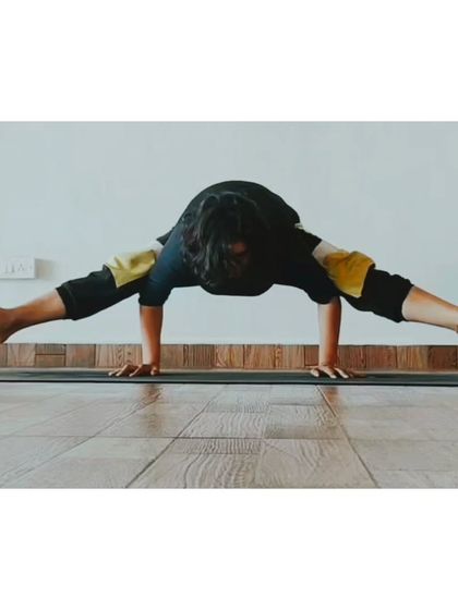 The Firefly Pose (Tittibhasana) is a challenging arm balance that also requires flexible hamstrings and hips. It's a beautiful expression of both strength and openness.