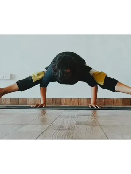 The Firefly Pose (Tittibhasana) is a challenging arm balance that also requires flexible hamstrings and hips. It's a beautiful expression of both strength and openness.