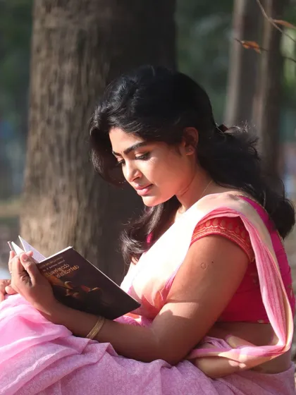 A close-up from the pink saree series. This shot shows the soft, natural makeup in detail, perfect for capturing a serene and peaceful mood on camera.