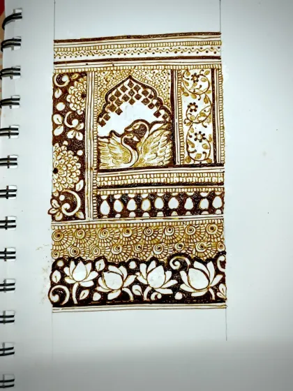 This is a design concept I sketched for a bridal arm piece. It features a pair of swans within a traditional jharokha window, surrounded by delicate floral work and a beautiful lotus border. I love bringing these story-based elements into my bridal mehendi.