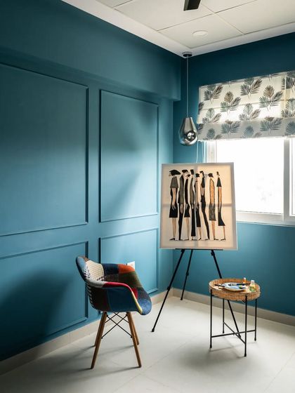 I designed this art room for a client who wanted a creative and inspiring space. The deep blue wall with classic molding creates a calming, focused atmosphere, perfect for painting or relaxing.