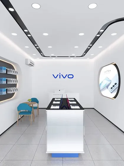 The interior render for the mobile store, featuring curved display niches and a central experience island. The design creates a futuristic and customer-friendly environment.