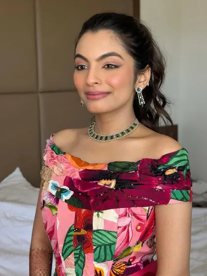 A portrait of the bride, looking effortlessly cool and chic. The reverse wing and colorful dress are a perfect match for a carnival-themed event.