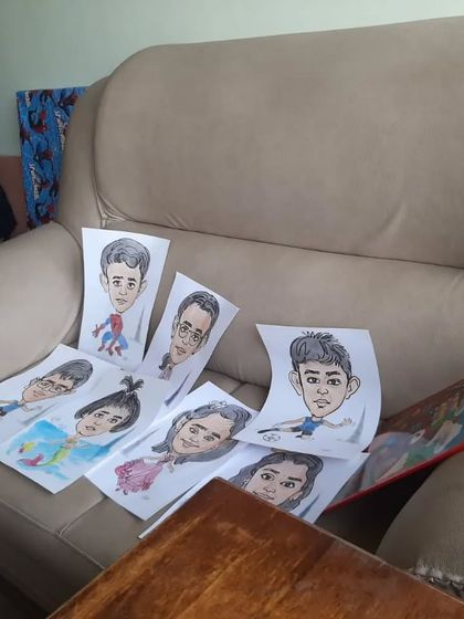 A collection of the day's work! Here are several finished caricatures ready for the kids to take home from a birthday party.