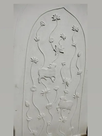 This is how a 3D relief mural looks before the magic of color is added. Just pure, hand-sculpted clay on a panel. You can see the forms of the cows and lotuses taking shape, ready to be brought to life.
