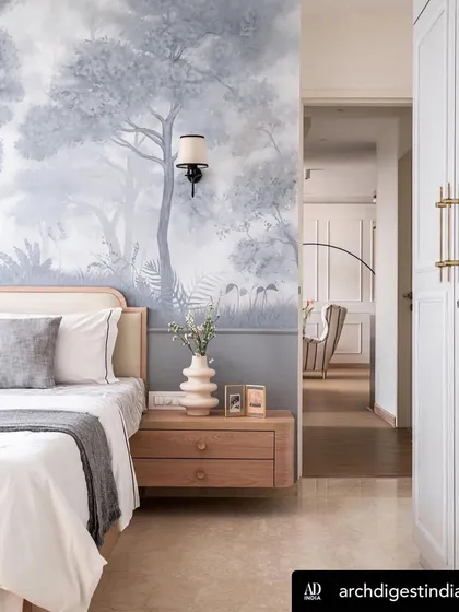 My 'Misty Forest' mural featured in Architectural Digest. This bedroom view shows how the monochromatic landscape creates a serene and sophisticated atmosphere, extending the sense of space.