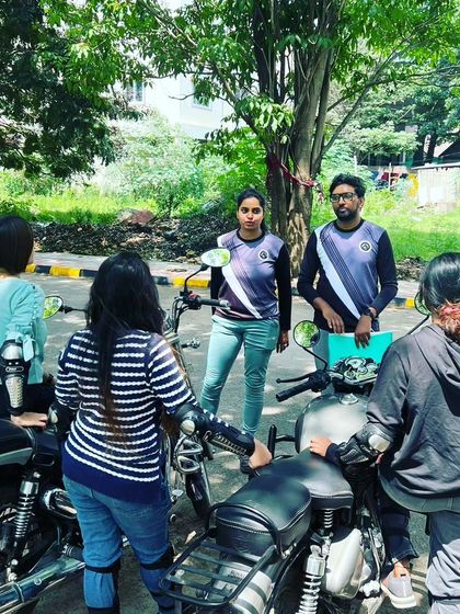 Our coaching team, including female instructors, leads a group session. We believe in learning from those who have been on the same journey.