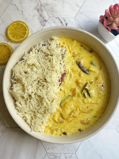 A light and tangy option, my Kadhi Chawal is perfect for any day. The yogurt-based curry with soft pakodis is served with plain rice, offering a simple taste of home.