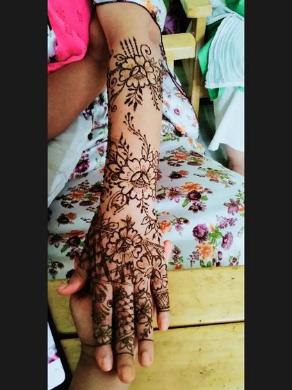 A full-arm floral vine design. This is a great option if you want an elaborate look that is not as dense as a traditional bridal pattern.