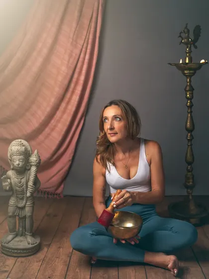 A portrait that speaks to mindfulness and inner peace. The use of a Tibetan singing bowl and other spiritual artifacts creates a serene and contemplative atmosphere. This Storybook session was designed to reflect the subject's personal journey and practice.