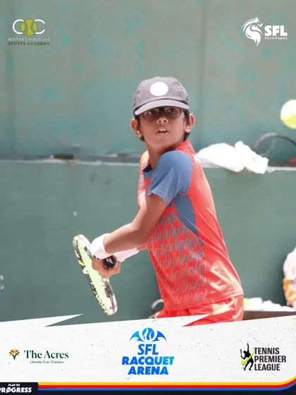 This young player shows great concentration and form as he prepares to hit a backhand during a Tennis Premier League match.