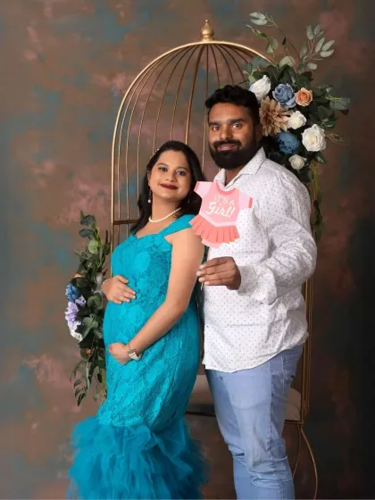 Another sweet gender reveal moment, with the dad-to-be holding a "It's a Girl!" prop. The joy on their faces is infectious.